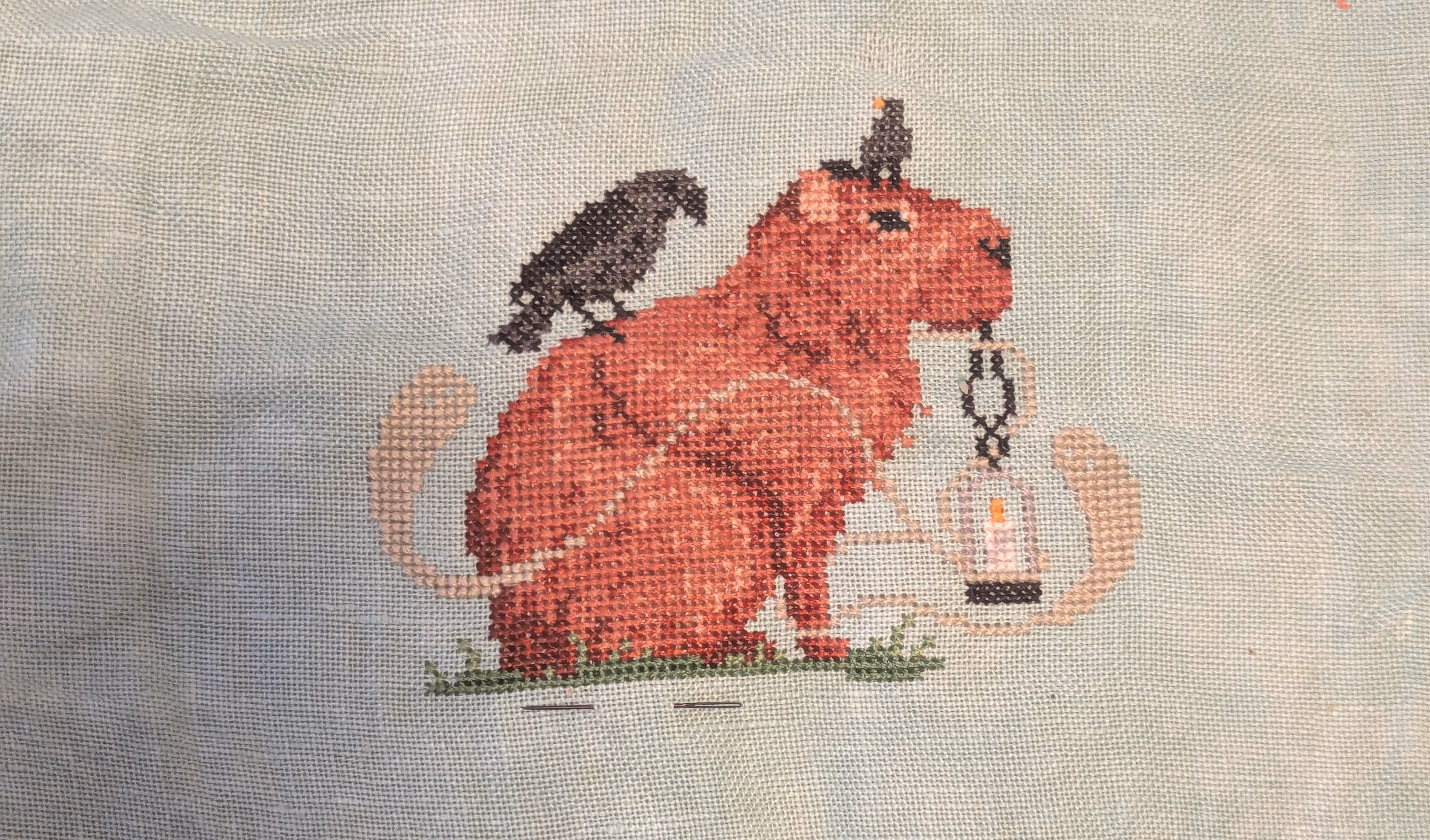 A capybara holds a latern in it's mouth surrounded by his ghost pals
