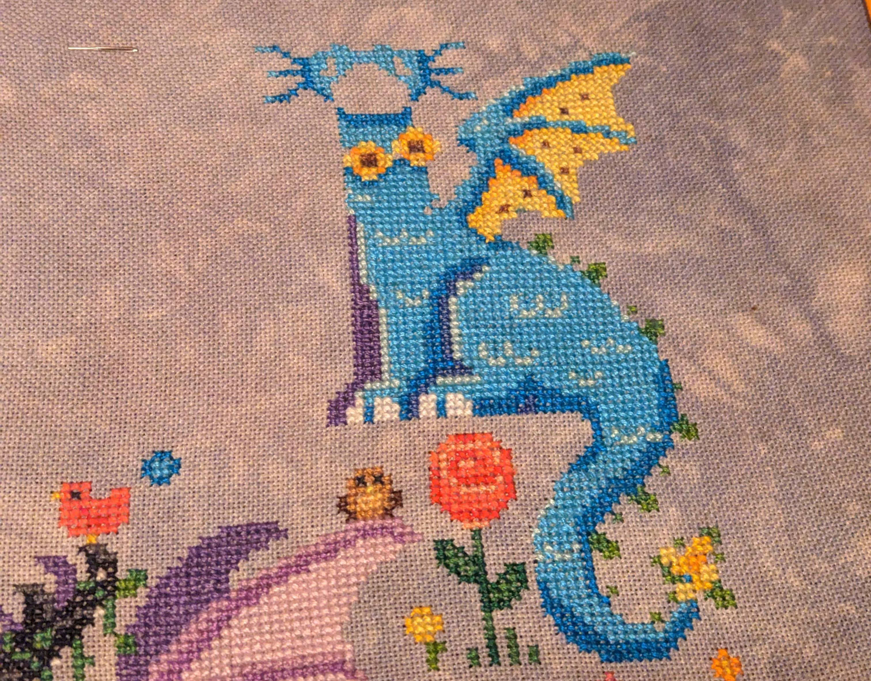 Image of a body of a dragon with blue scales and a sunflower for a tail