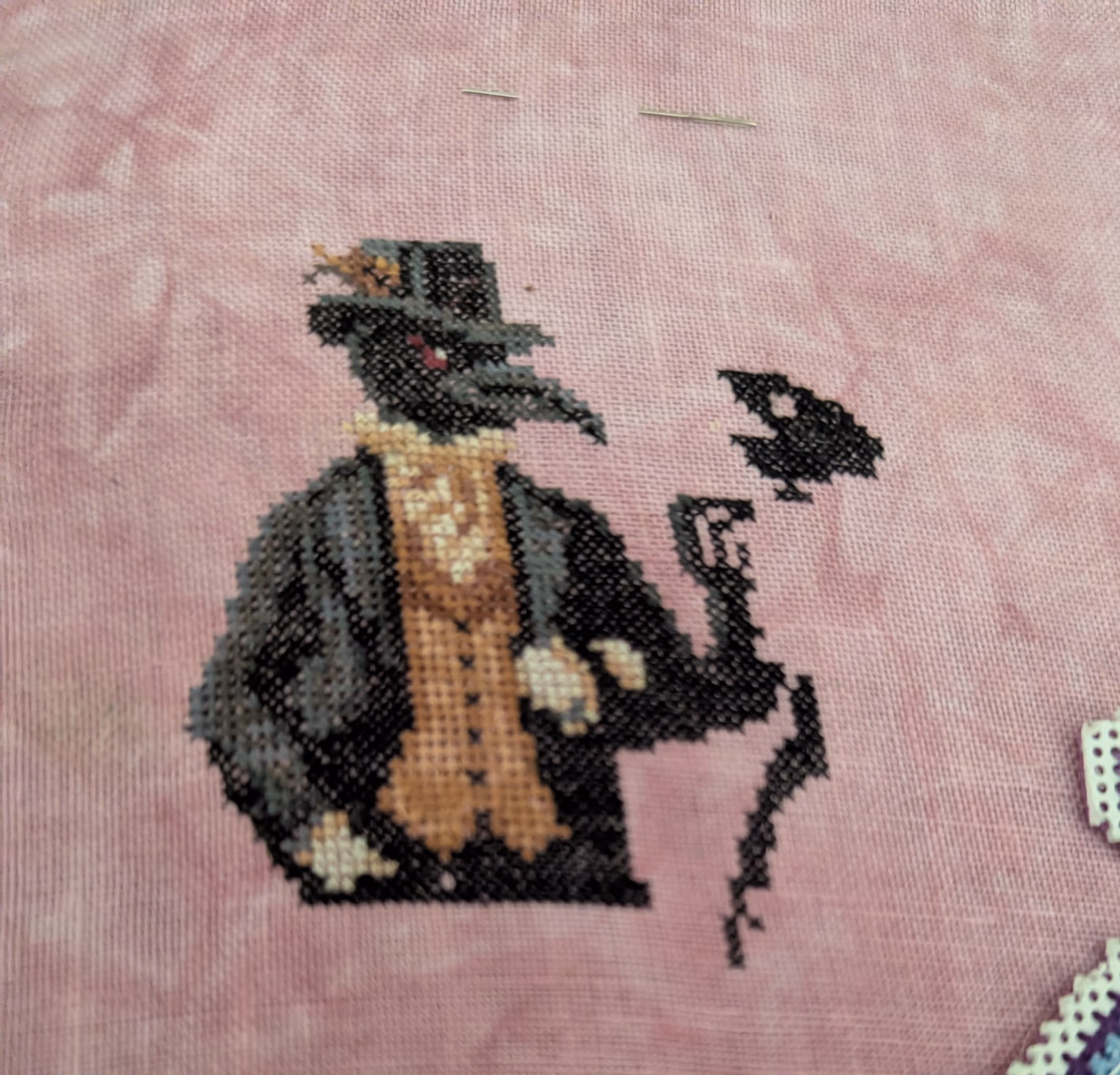 Two corvids walk hand in hand at a cemetary
