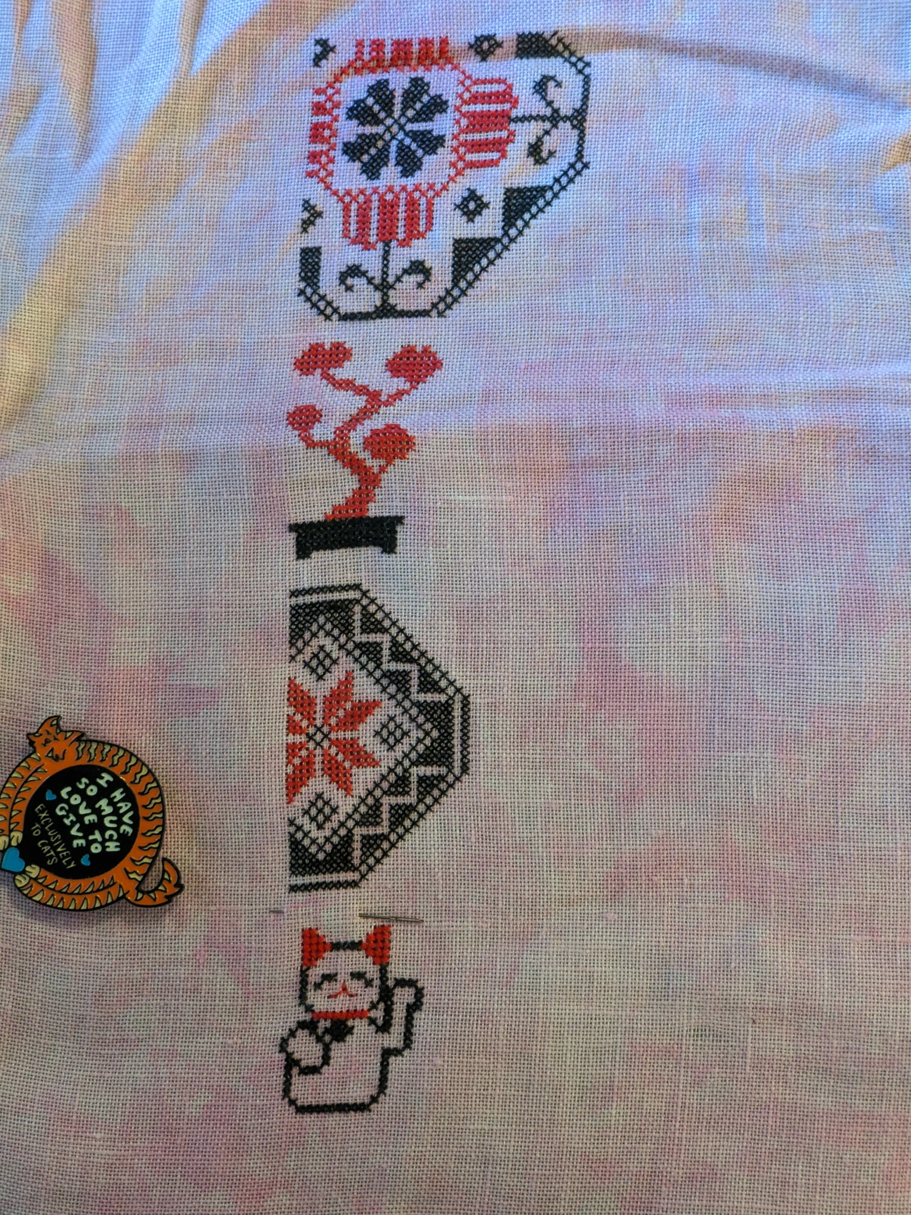 Image of a Quaker style cross stitch sample whose subject matter is Japan