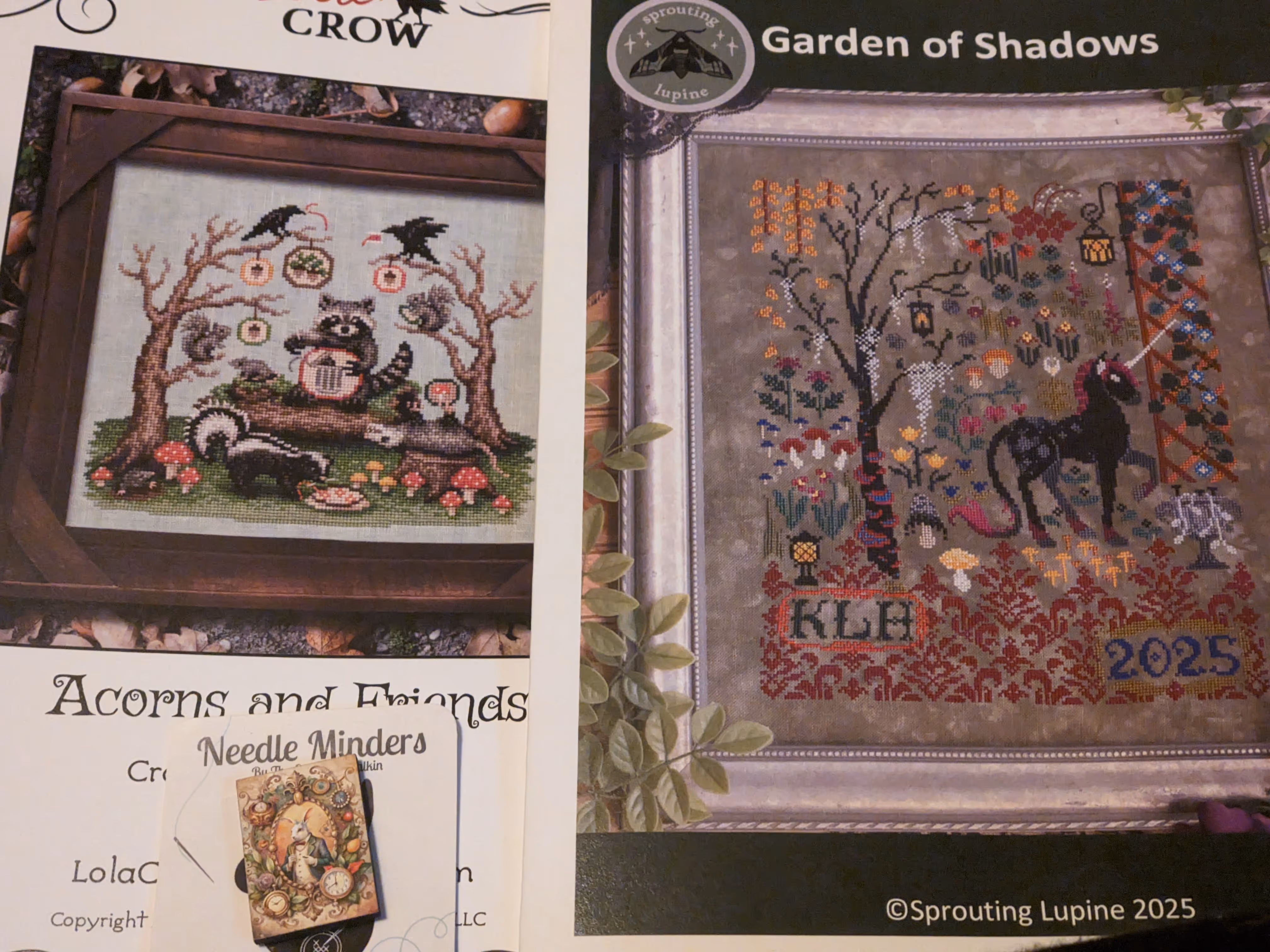 image of two cross stitch charts featuring cute animals from Lola Crow and a fantasy scene from Sprouting Lupine