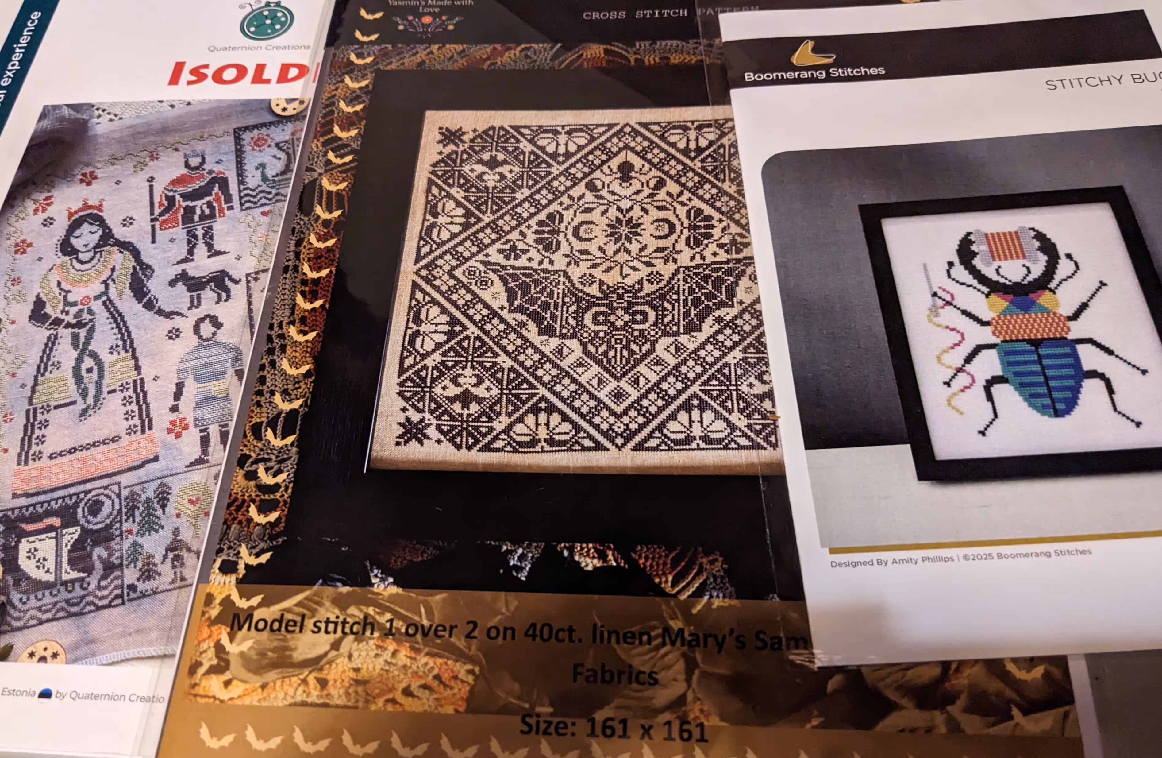 image of three cross stitch charts featuring Isolde, a bat, and a beetle