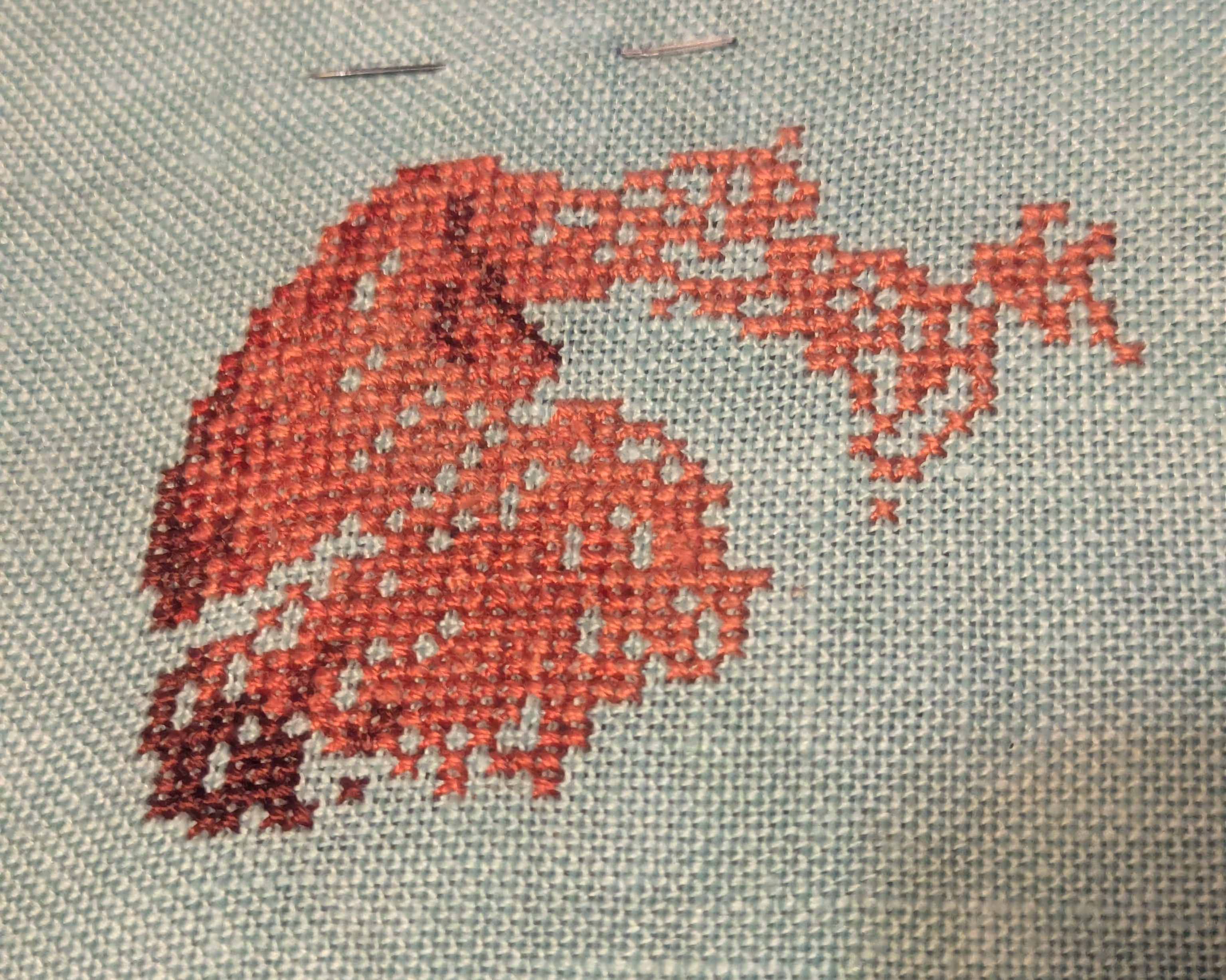 The beginnings of a cpybara in shades of brown and orange like their fur