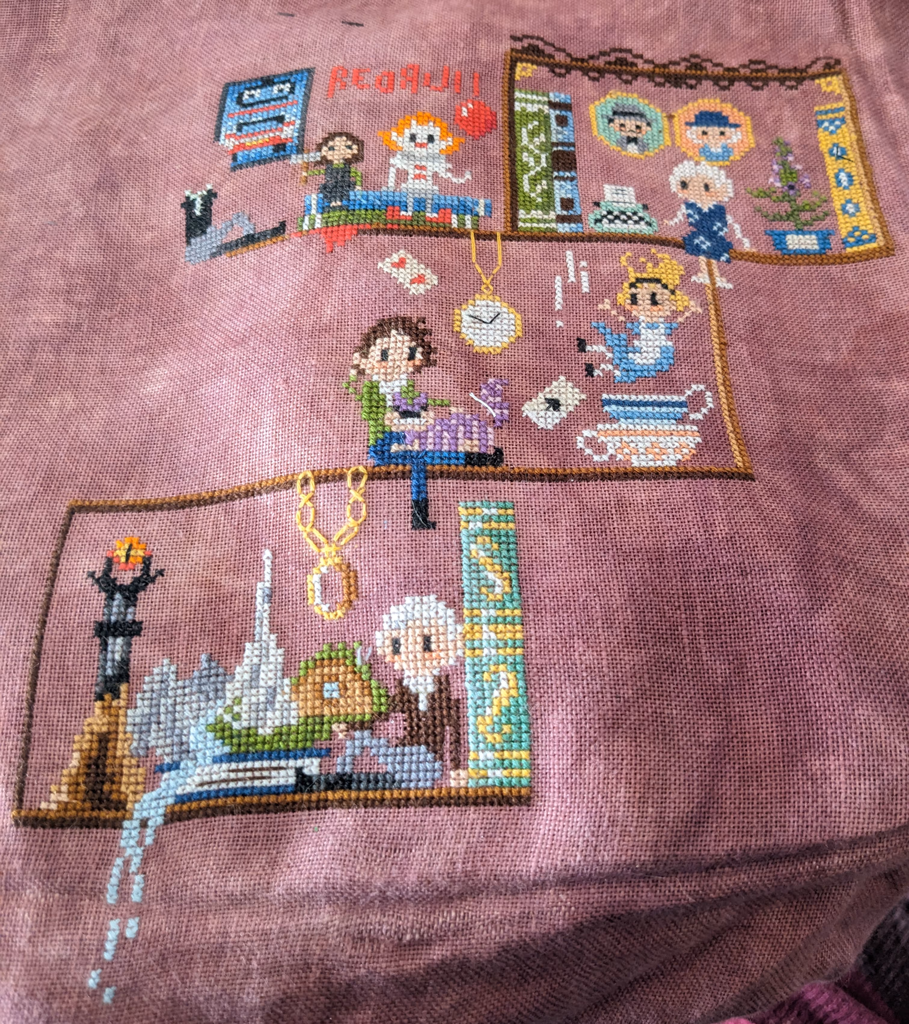 Image of cross stitch featuring different authors with elements of their books on a bookshelf