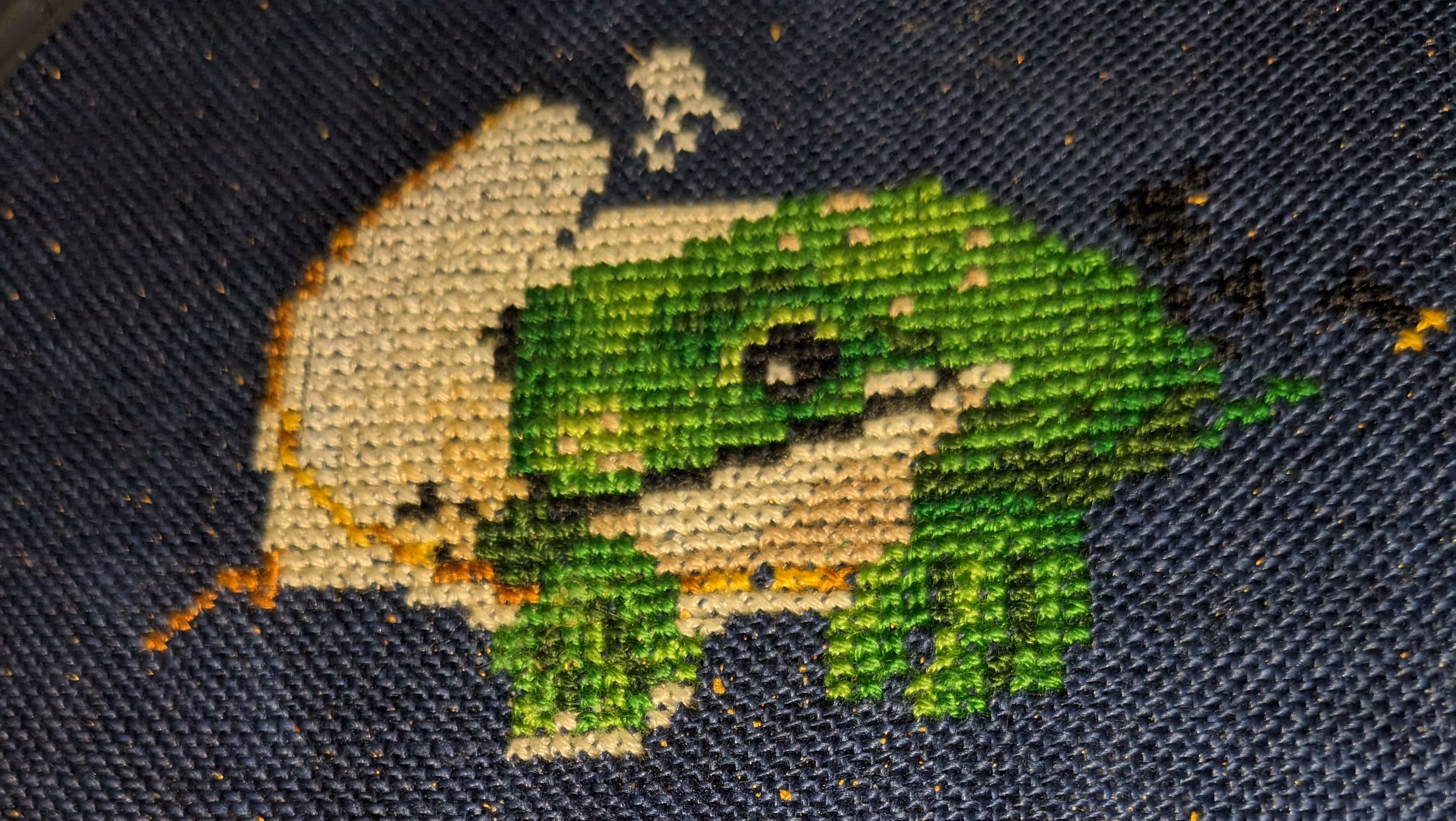 A frog sits calmly in a tea cup in blue and white china