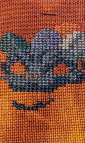 A collection of colorful dragons from mythology on a sunburst fabric in red and yellow