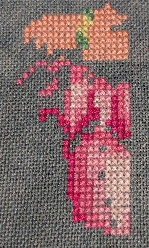 The top of the dress in shades of pink